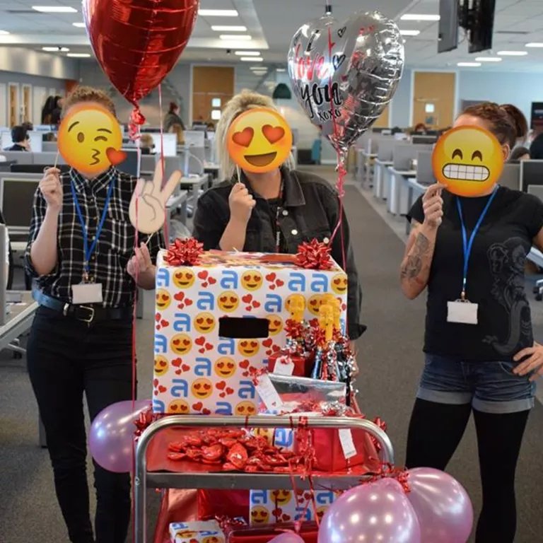 3 people celebrating with gifts for the team 3 people celebrating with gifts for the team